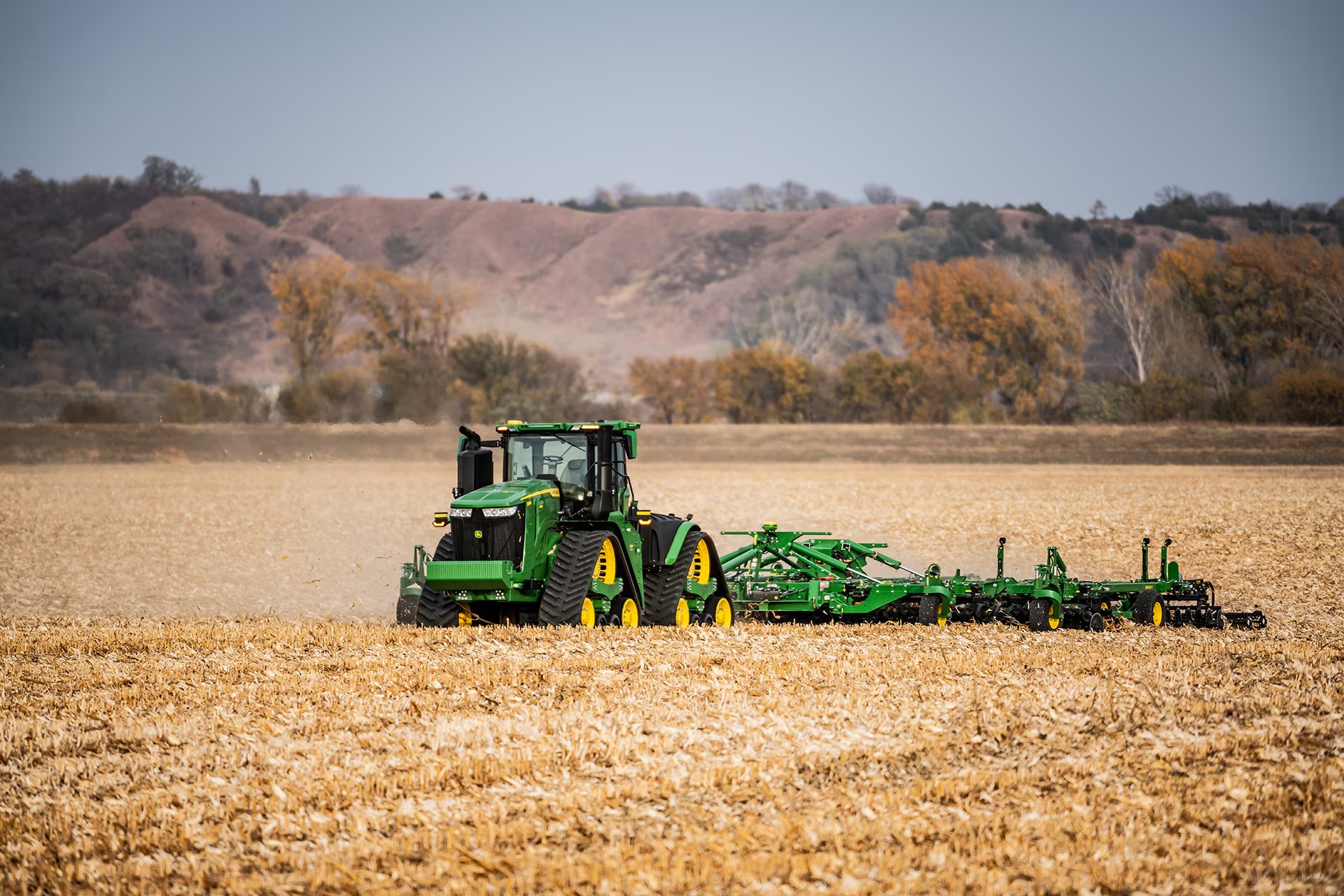 Image with a tractor working in the background